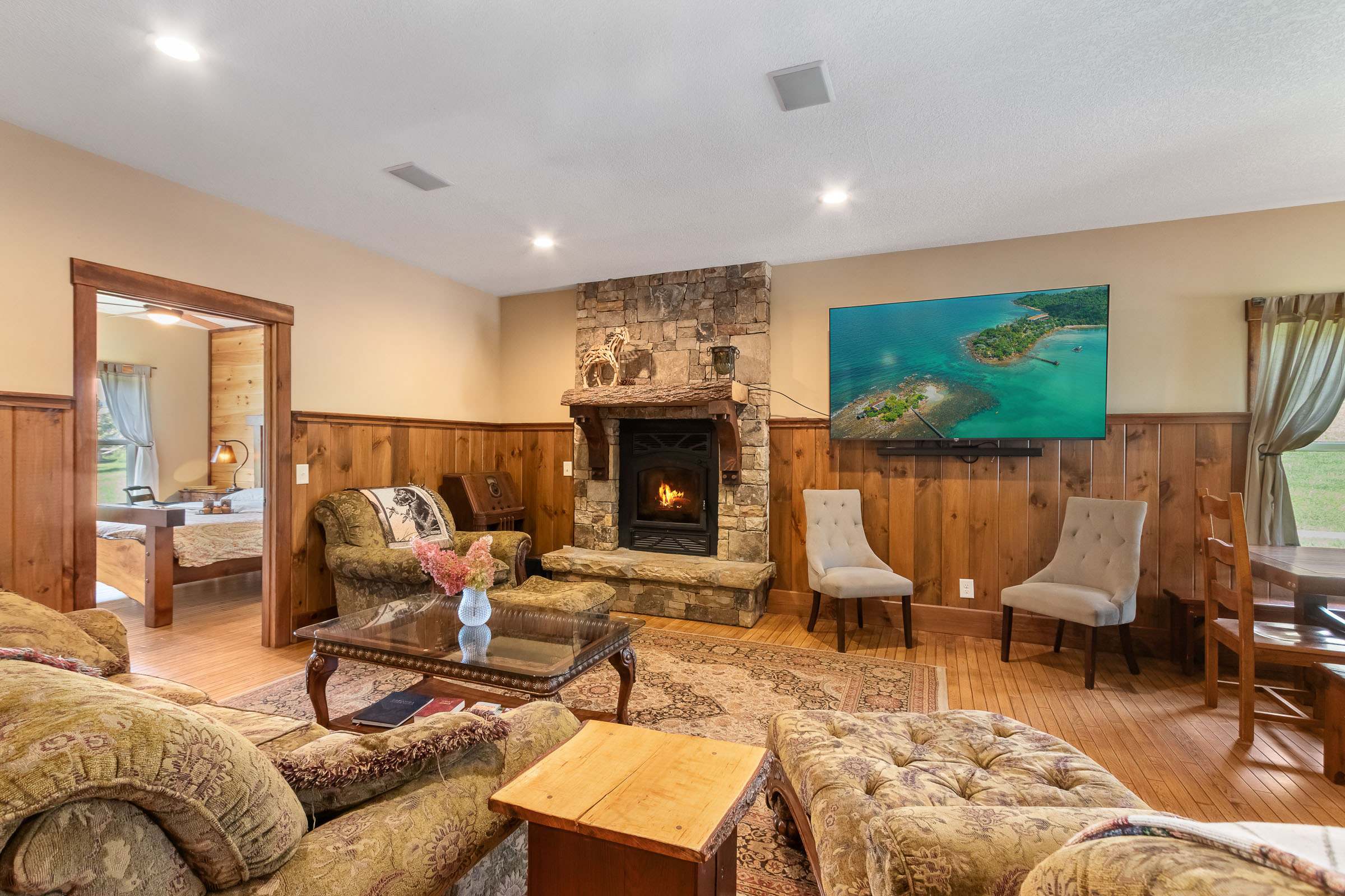Stone fireplace and sitting area inside The Millhouse Lodge