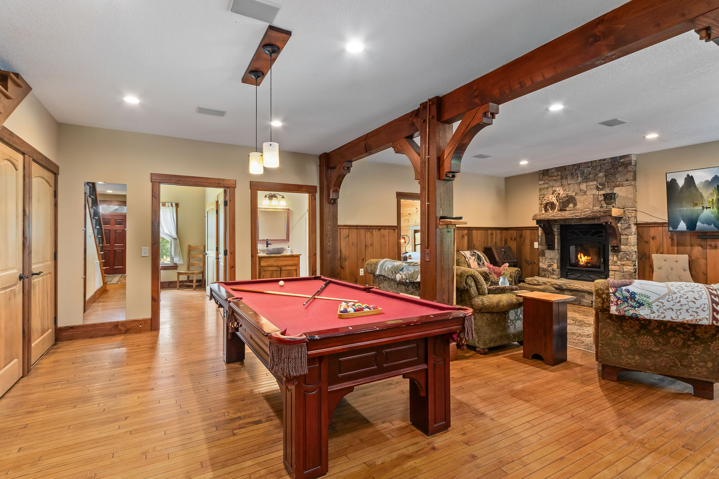 Pool table and lounge area inside The Millhouse Lodge gathering room