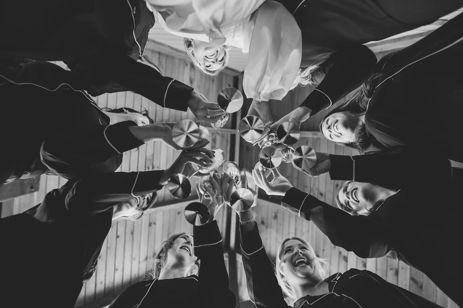 Wedding party celebrating inside the timber-framed lodge